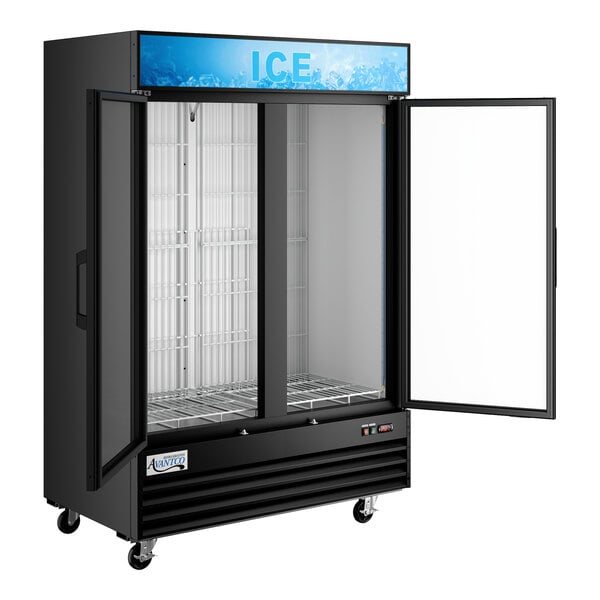 A large black indoor glass door ice merchandiser with two doors, shelving, and wheels.