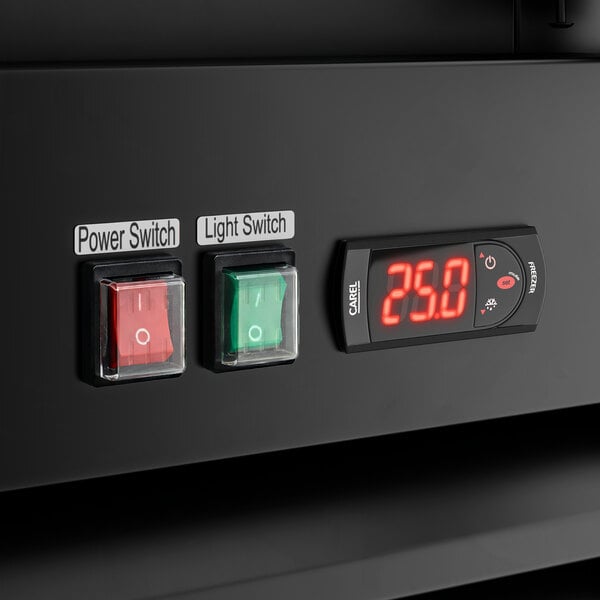 A control panel with a red power switch, a green light switch, and a digital temperature display on an Avantco GD-ICE-49F indoor glass door ice merchandiser.