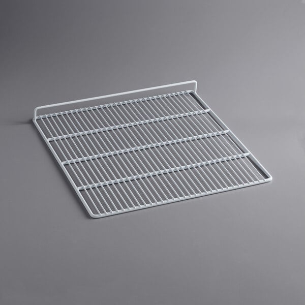 A white metal grid shelf for an Avantco Deli Case.