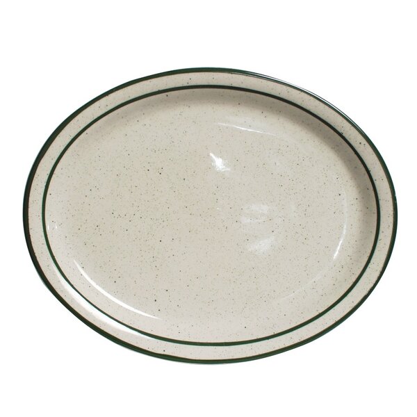 A white Tuxton china platter with a green speckled rim.