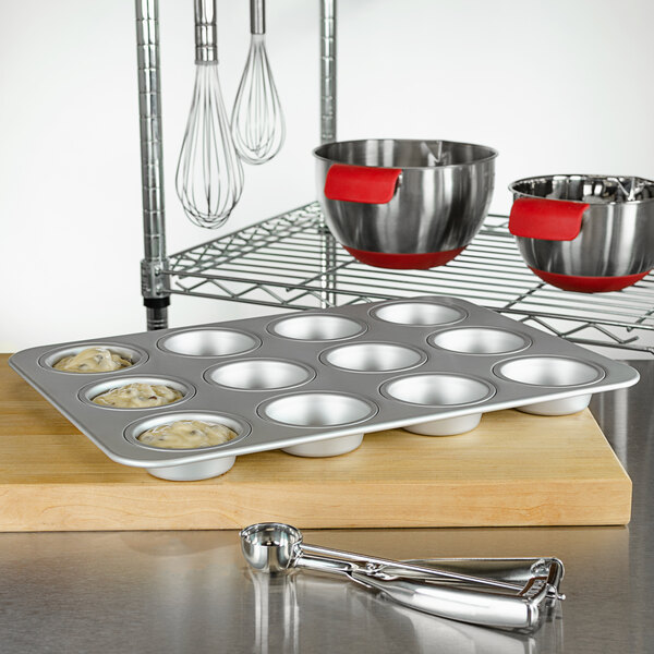 Fat Daddio's MFN-STD ProSeries 12 Cup 3.3 oz. Anodized Aluminum Muffin / Cupcake Pan - 17" x 11 1/2"