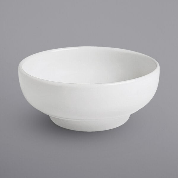 A bright white porcelain footed bowl.