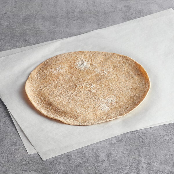 A Father Sam's Bakery organic wheat tortilla on white paper.