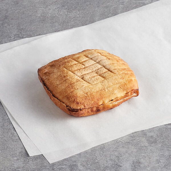 Father Sam's Bakery white square pita sandwich bread on white paper.