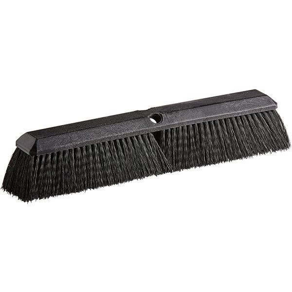 A black Carlisle push broom head with polypropylene bristles.