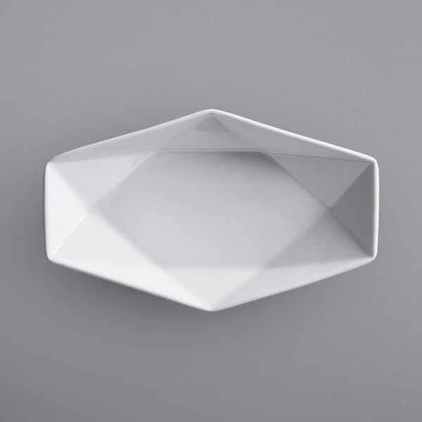 A white hexagonal plate with a white border on a gray background.