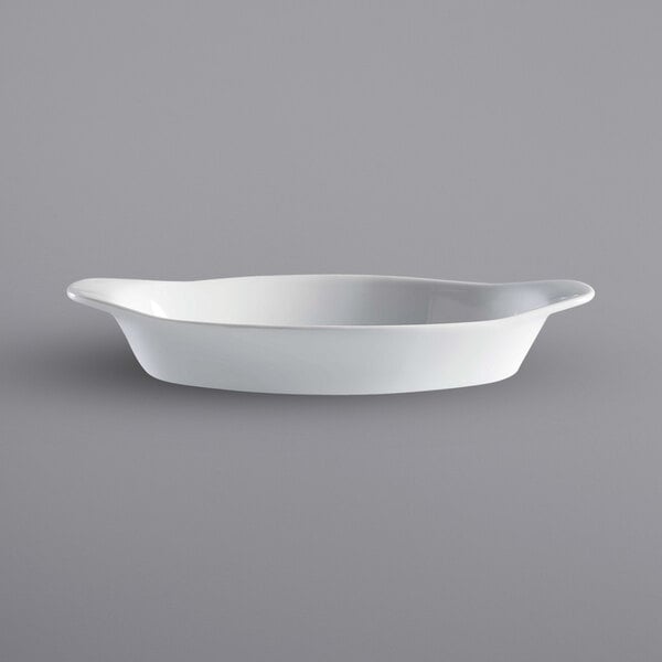 A white oval dish with a handle.