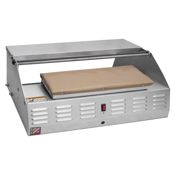 A Heat Seal 500A countertop wrapping machine with a metal cover.