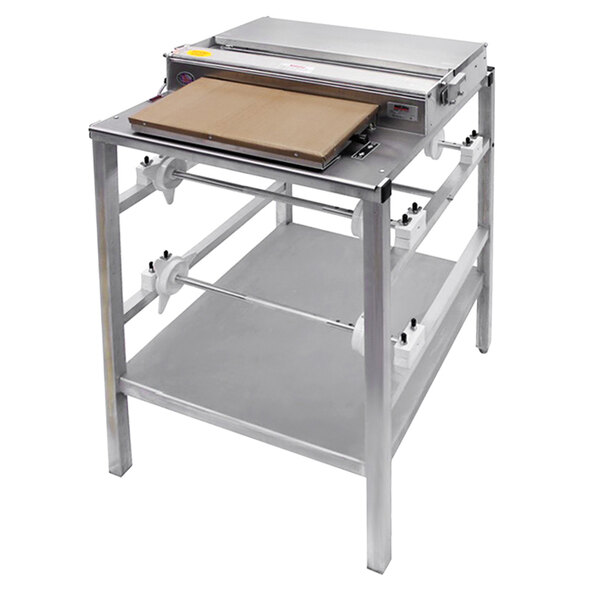A Heat Seal triple roll film wrapping machine with a wood board on it.