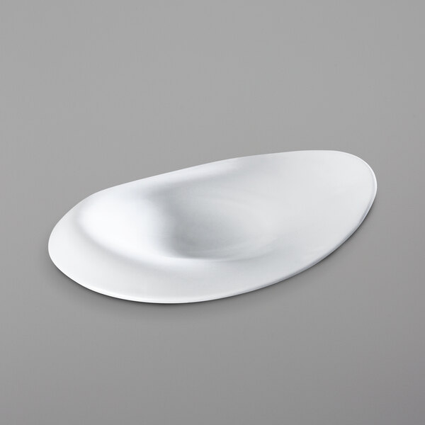 A white oval shaped Corona porcelain plate.