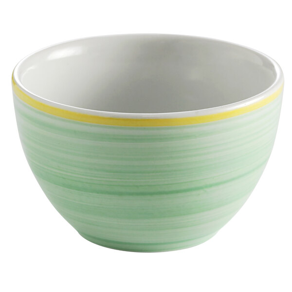 A green and yellow bowl with a white rim.