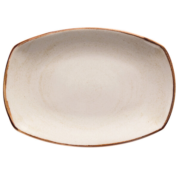 A beige porcelain oval platter with brown edges.