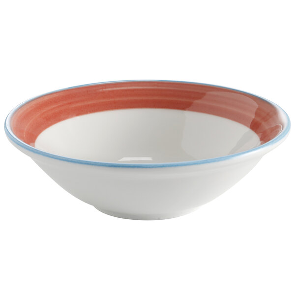 A white bowl with a coral and blue rim.