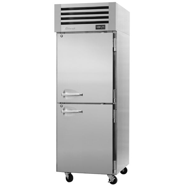A silver Turbo Air Premiere Pro Series reach-in refrigerator with two half doors.