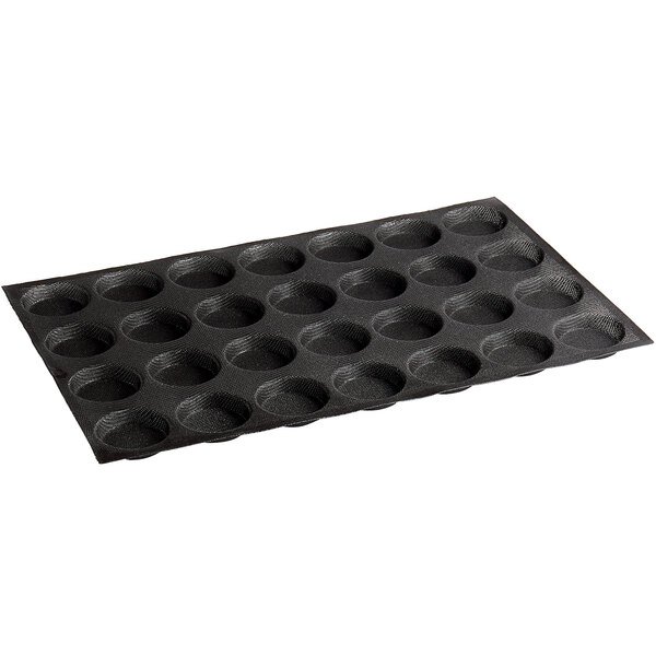 A black silicone baking tray with 28 choux cavities.