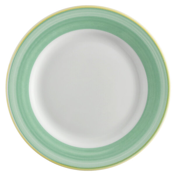 A white porcelain plate with a green and yellow rim.