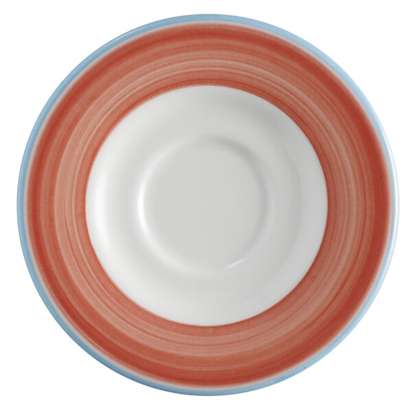 A white porcelain saucer with rolled edges and a circular coral and blue pattern.