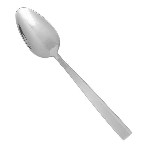 A close-up of a Fortessa stainless steel dinner spoon with a silver handle.