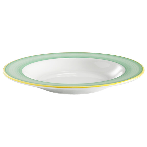 A white bowl with green and yellow rim.