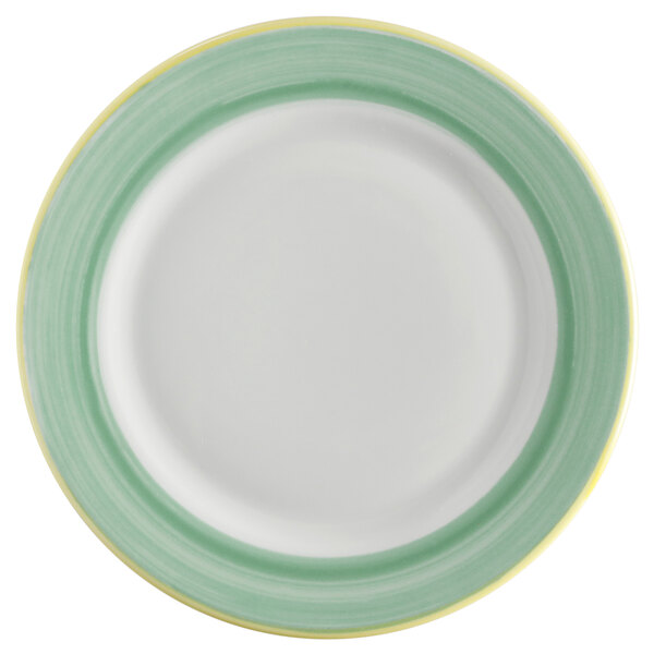 A white porcelain plate with green and yellow trim.