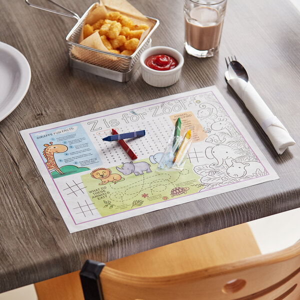 A wooden table with a Choice kids zoo themed placemat and food on it.