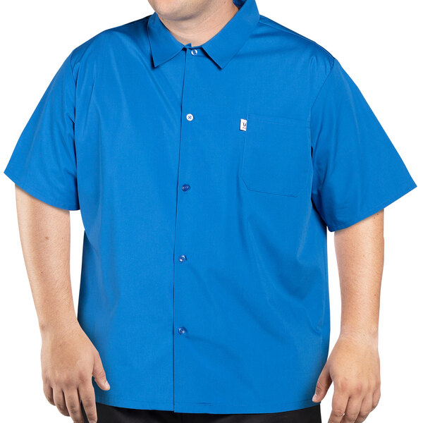 A man wearing a royal blue Uncommon Chef cook shirt.