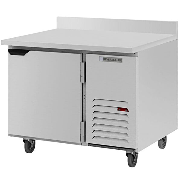 A white stainless steel Beverage-Air worktop refrigerator with a door on wheels.