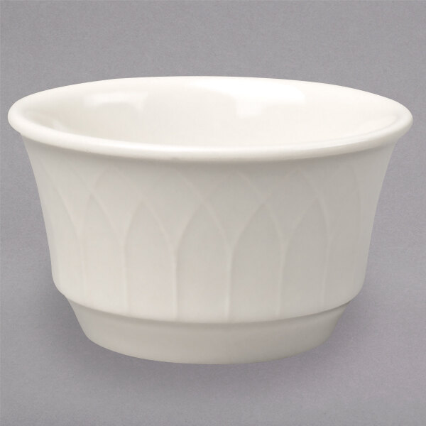 A white Homer Laughlin ramekin with a small rim.