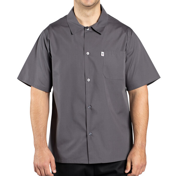 A man wearing a slate gray Uncommon Chef cook shirt.