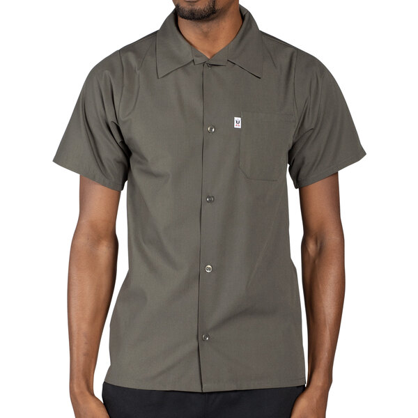 An olive green men's short sleeve cook shirt with a front pocket.