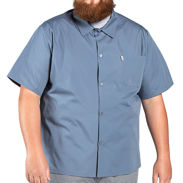 A bearded man wearing a Uncommon Chef classic short sleeve cook shirt in steel gray.