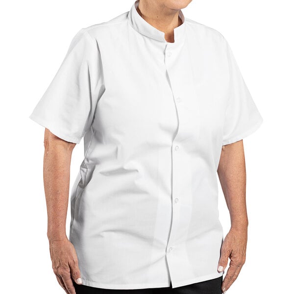 A woman wearing a white Uncommon Chef cook shirt with a mandarin collar.