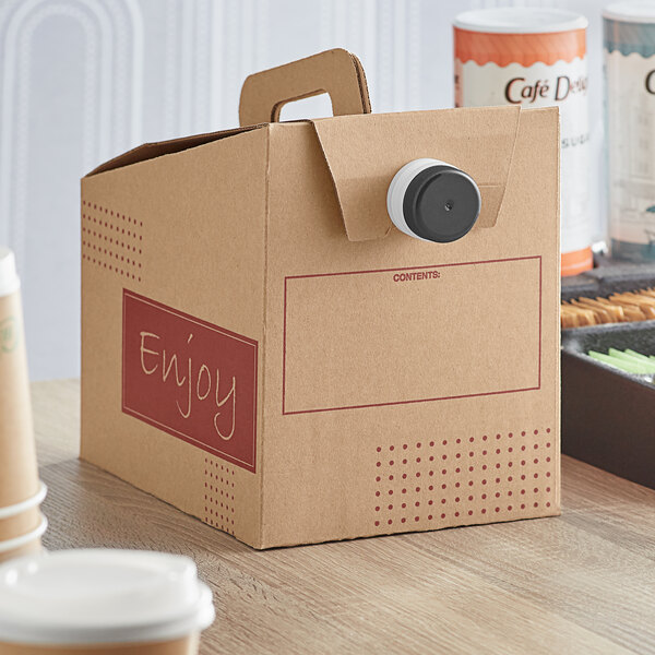 A cardboard box with a lid filled with white paper coffee take out containers.