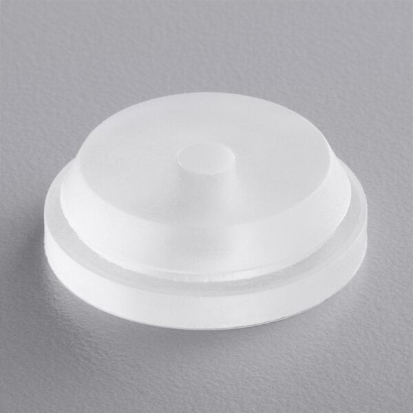 A white plastic disc with a round center.