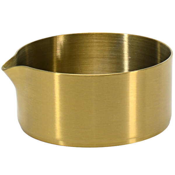 A gold colored metal bowl with a spout.