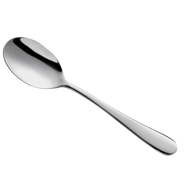 A close-up of an Arcoroc stainless steel soup spoon with a white handle.