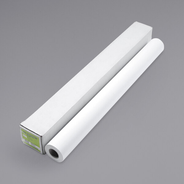 A roll of HP DesignJet coated white large format paper with a green and white label.