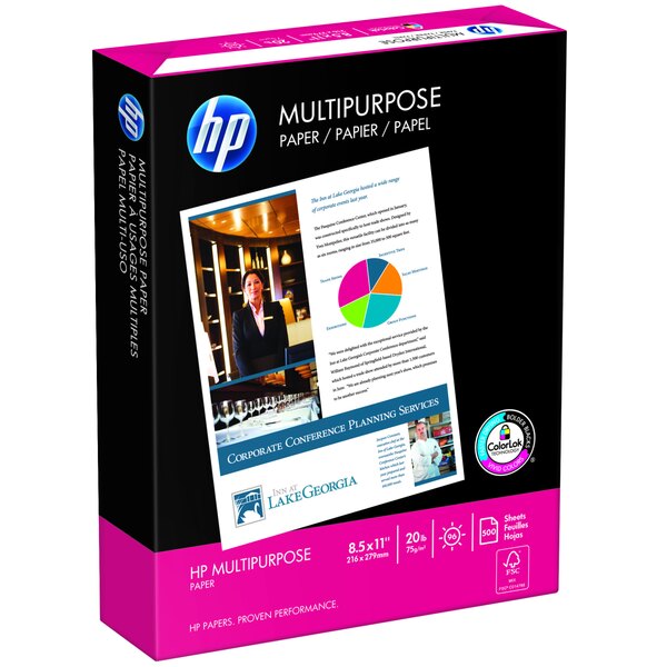 A box of HP Inc. white multipurpose paper on a table with a woman in a suit.