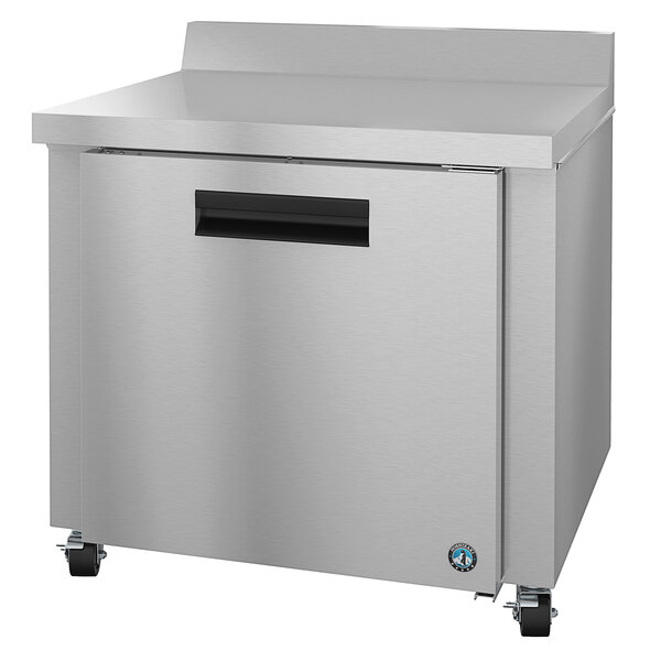 A stainless steel Hoshizaki worktop refrigerator with a drawer on wheels.