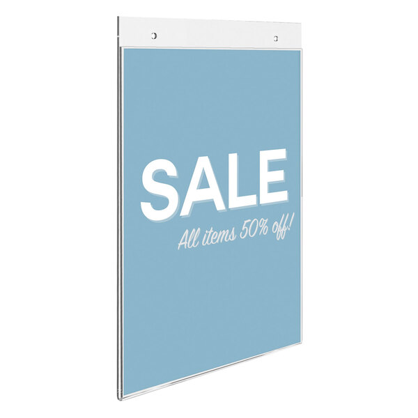 A blue sign with white text in a Deflecto Classic Image wall-mounted sign holder.