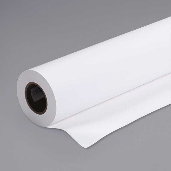 An Epson white paper roll with a label on a gray background.
