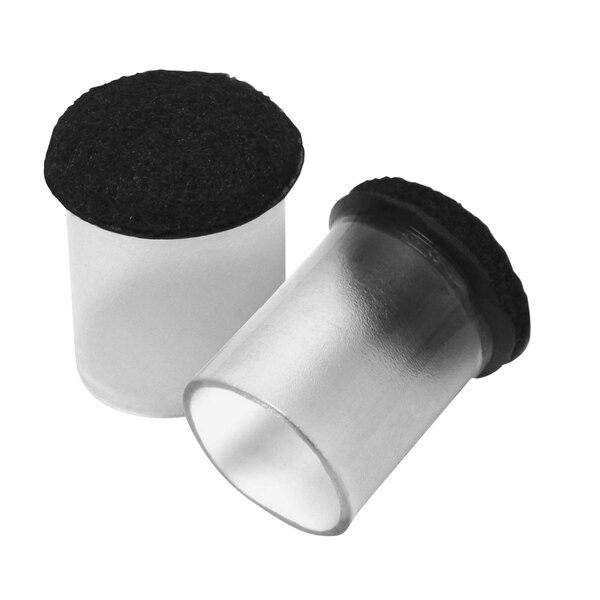 Two white plastic cylinders with black lids.