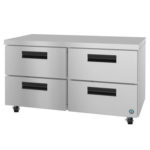 A silver metal cabinet with black drawers on wheels.