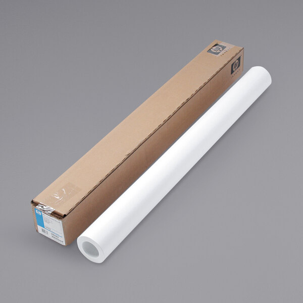 A long cardboard box with a roll of HP Inc. DesignJet translucent large format paper next to it.