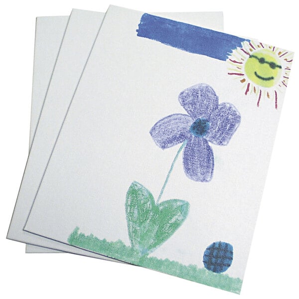 A stack of Pacon Art Street canvas panels with a drawing of a flower and a sun on white paper.