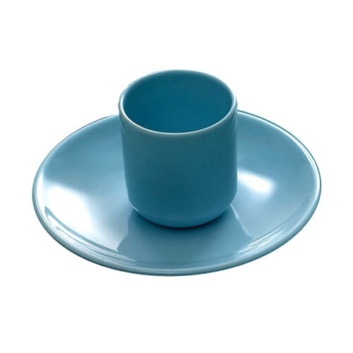 A blue cup and saucer on a blue oval melamine platter.