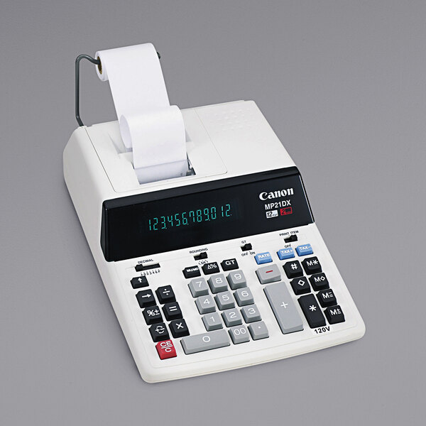 A Canon MP21DX two-color printing calculator with paper roll on top.