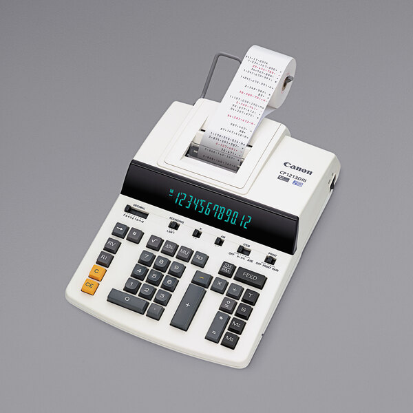 A Canon heavy-duty commercial desktop printing calculator with a roll of paper.