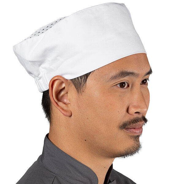 A man wearing a Uncommon Chef white chef's hat.