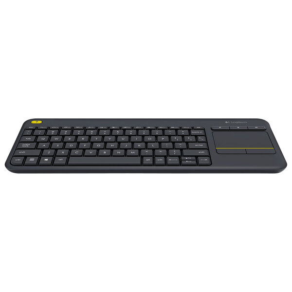 A black Logitech K400 Plus wireless keyboard with a touchpad on a table.